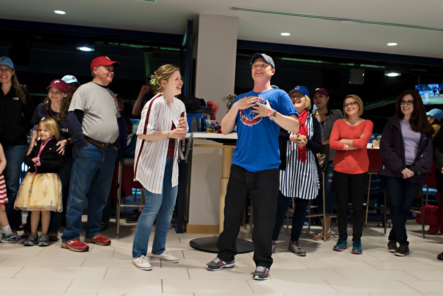 The groom announcing he is a cubs fan at his Phillies game wedding.